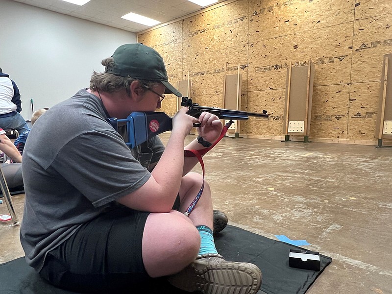 Faulkner County 4-H member Bodie Smith takes aim at a target set up in the Faulkner County Extension Office during the Arkansas BB Shooting Championship. (Special to The Commercial/Tracy Courage/University of Arkansas System Division of Agriculture)