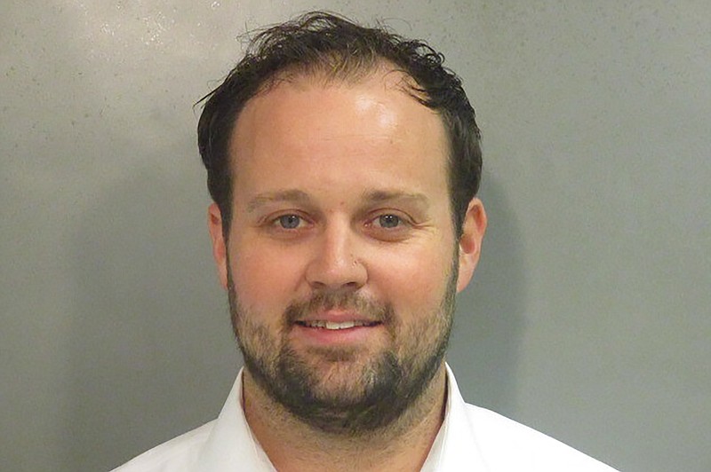FILE - This undated photo provided by Washington County, Ark., Detention Center shows Josh Duggar. An attorney for Duggar asked a federal appeals court panel on Thursday, Feb. 16, 2023, to reverse the former reality TV star's conviction for downloading child pornography, saying investigators violated his rights by seizing the phone he was using to try to call his lawyer during the search that found the images. (Washington County Detention Center via AP, File)