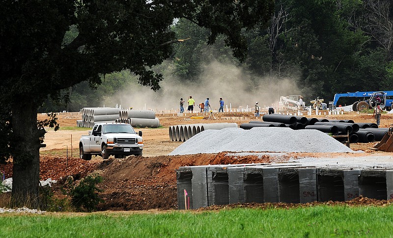 Construction work on Lindsey Management's 487 unit Trails at Rainbow Curve apartment development near the company's current The Links at Rainbow Curve apartments in Bentonville on Thursday July 17, 2014. (NWA DEMOCRAT-GAZETTE/FILE PHOTO)