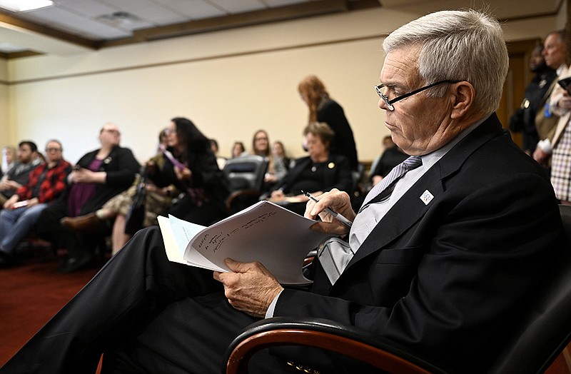 Senator Dan Sullivan, R-Jonesboro, looks over the text of his bill during public testimony against Senate Bill 81, which would change the law concerning libraries and obscene materials, during a meeting of the Senate Committee on Judiciary at the State Capitol on Monday, Feb. 20, 2023.

(Arkansas Democrat-Gazette/Stephen Swofford)