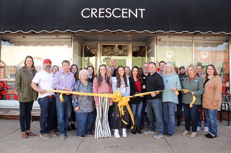 Lynn Kutter/Enterprise-Leader
Prairie Grove Chamber of Commerce sponsored a ribbon cutting Feb. 11 for Crescent and its new owners in downtown Prairie Grove.  Owners Audrey and Damon Wetzel, of Prairie Grove, stand in the front with the scissors.