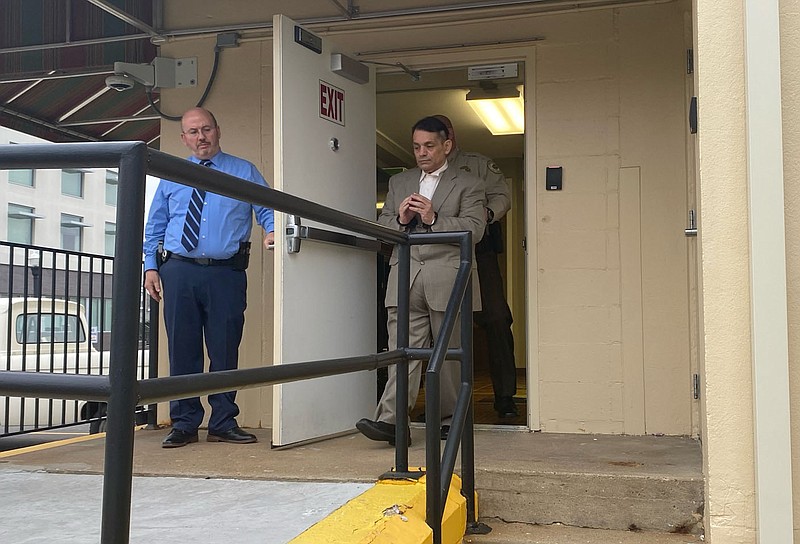 Mauricio Torres is led out of a Benton County courtroom following his sentencing hearing on Tuesday. A jury found Torres guilty of murdering his 6-year-old son. Torres was sentenced to life in prison on Wednesday.
(NWA Democrat-Gazette/Tracy Neal)