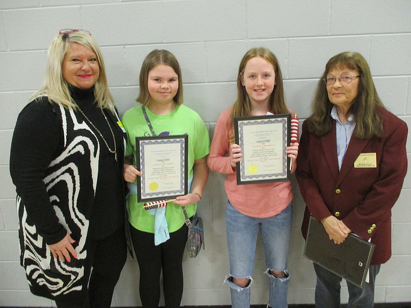 The Fayetteville/Springdale Elks Lodge #1987 held its annual Americanism Essay Contest.This years theme was "What is Your American Dream?" Winners in the sixth grade division were : Emma Hampton (first place) from McNair Middle School, Louisa Tullis (second place) from Prairie Grove Middle School and Capri Conkle (third place) from Prairie Grove Middle School. Winners in the seventh- and eighth-grade divisions were: Elizabeth Burns (first place in the seventh-grade division) from Prairie Grove Junior High, Mini Newman, (first place winner in the eighth-grade division) from Prairie Grove Junior High, Clara Stephens (second place in the eighth-grade division) from Prairie Grove Junior High, and Maria Aguirre (third place in the eighth-grade division) from Prairie Grove Junior High. Each received a certificate, a small flag, a flag pin, and a check for winning. First place winners received $75, second place winners received $50 and third place winners received $25. The students winning essays were sent to state competition.

1st picture: Kim Mcgaughry, drug awareness chair, Louisa Tullis, Capri Conkle, both sixth-grade winners from Prairie Grove Middle School and Marge Guist, Americanism Chair

2nd picture: Emma Hampton sixth-grade student from McNair Middle School and Marge Guist, Americanism chair

3rd picture: Elizabeth Burns seventh-grade winner, Clara Stephens eighth-grade winner, Marge Guist, Americanism chair, Maria Aguirre eighth-grade winner and Mini Newman eighth-grade winner.