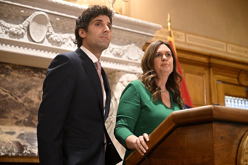 Gov. Sarah Huckabee Sanders answers questions from reporters with her husband, Bryan Sanders, during a press conference announcing her husband as the head of a new council to promote outdoor recreation and tourism in Arkansas. (Arkansas Democrat-Gazette/Stephen Swofford)