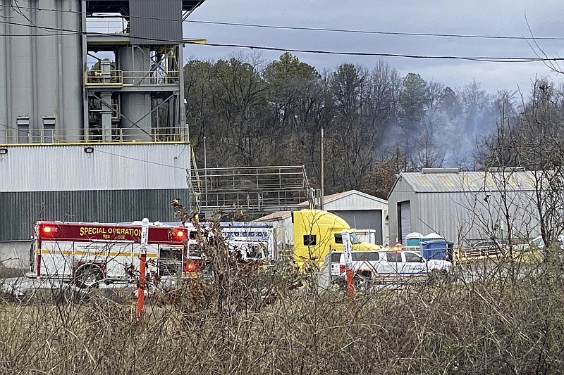 Emergency personnel respond to the scene after a small aircraft crashed while taking off from the Bill and Hillary Clinton National Airport in Little Rock, Ark., Wednesday Feb. 22, 2023. (Staci Vandagriff/Arkansas Democrat-Gazette via AP)