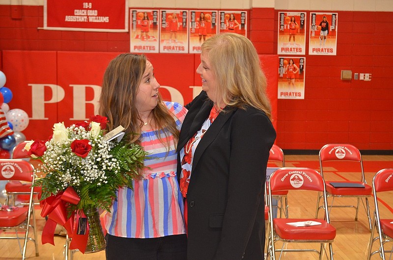 Drew Central schools Superintendent Kimbraly Barnes presents Milken Education Award winner Emily Howard with a flower arrangement. (Special to The Commercial/Richard Ledbetter)

CORRECTION Kimbraly Barnes is superintendent of Drew Central Schools. An earlier version of this cutline misspelled Barnes' name.