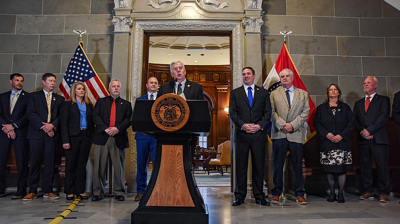 Julie Smith/News Tribune
Flanked Thursday by elected Missouri officials and  representatives of agricultural agencies and associations, Gov. Mike Parson speaks to the media about a lawsuit filed by Attorney General Andrew Bailey against the Biden Administration regarding proposed Waters of the United States rules.