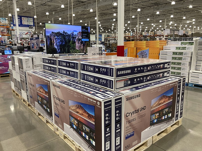 Big-screen televisions are displayed in a Costco warehouse Monday, Feb. 21, 2023, in Sheridan, Colo. On Friday, the Commerce Department issues its January report on consumer spending. (AP Photo/David Zalubowski)