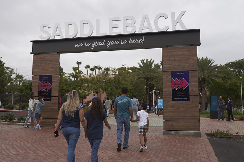 FILE - Congregants arrive at Saddleback Church in Lake Forest, Calif., on Sunday, Oct. 16, 2022. On Tuesday, Feb. 21, 2023, the Southern Baptist Convention ousted its second-largest congregation — Saddleback Church, the renowned California megachurch founded by pastor and best-selling author Rick Warren — for having a woman pastor. (AP Photo/Allison Dinner, File)