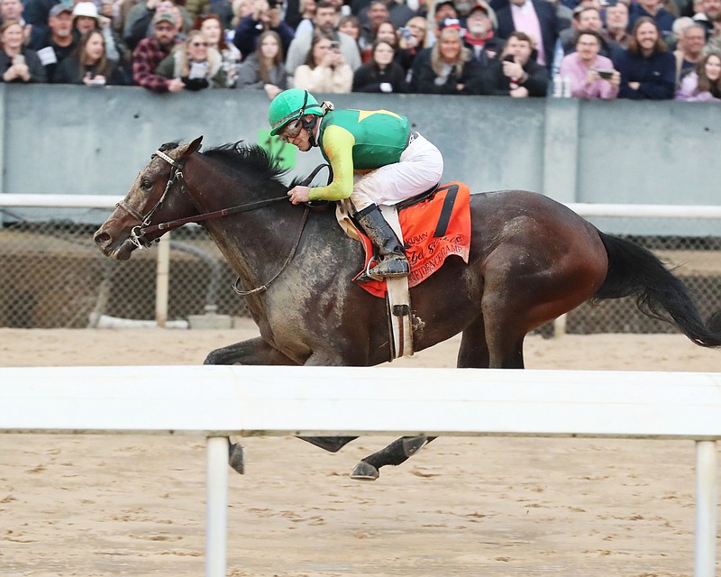 Confidence Game, under James Graham, wins the Grade 2 $1 million Rebel Stakes Saturday at Oaklawn. - Photo courtesy of Coady Photography