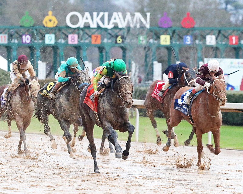 Confidence Game (7) battles with Red Route One (3) in the Grade 2 $1 million Rebel Stakes Saturday at Oaklawn. - Photo courtesy of Coady Photography