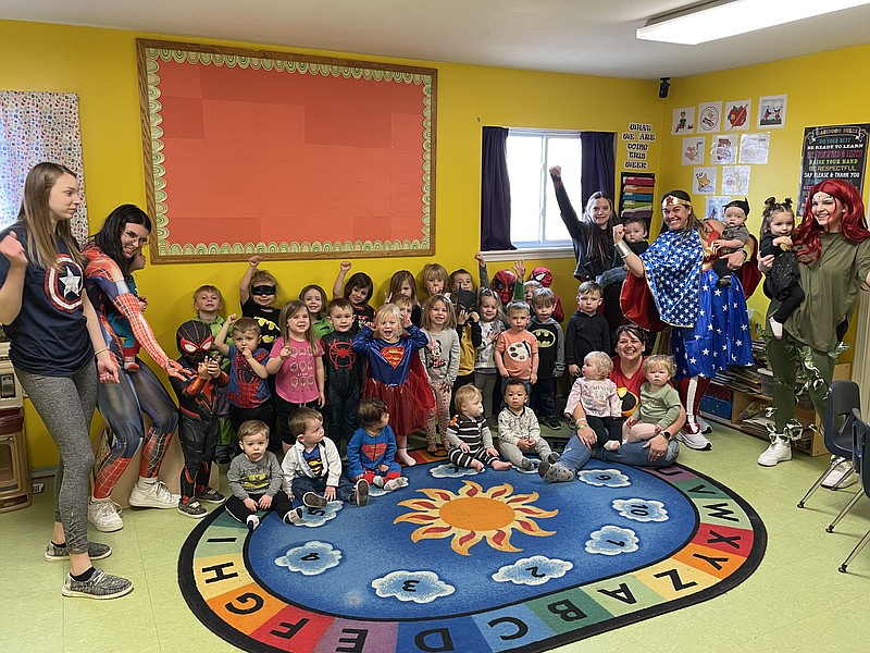 Democrat photo/Kaden Quinn
California Kids LLC Learning Center and Daycare staff and students gather to celebrate the 17th Annual Missouri Credit Union Miracles for Kids Radiothon dressed as their favorite superheroes.