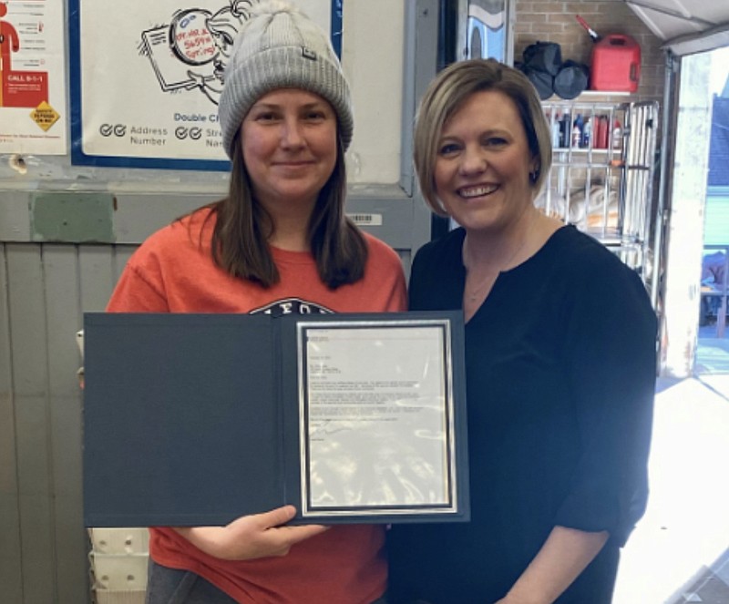 Submitted/Courtesy of Mark Inglett 
Postmaster Krystal Drone,right, awards rural mail carrier Olivia Allee, left, with the Postmaster General's Hero award for her service assisting a customer during a life threatening situation.