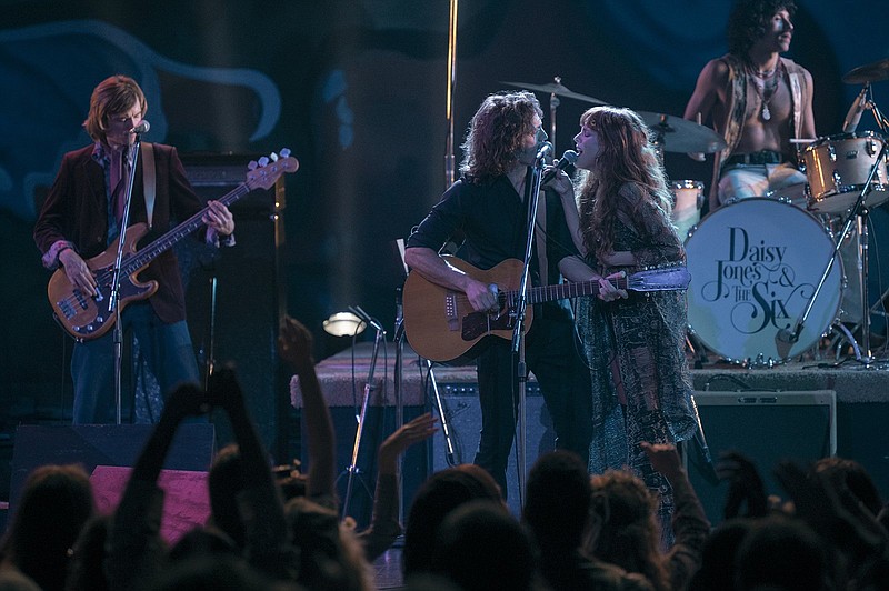 Sam Claflin (center) and Riley Keough (right) star in “Daisy Jones & The Six,” which is now streaming on Prime Video. (Prime Video/TNS/Lacey Terrell)