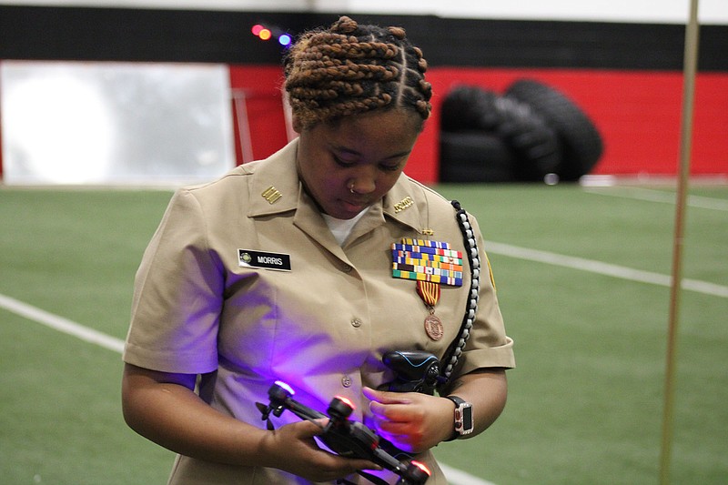 Photo by Michael Hanich
Indyia Morris prepares a drone to fly as part of Camden Fairview's NJROTC program at CTE day.