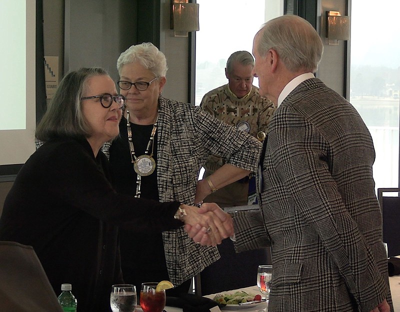Bitty Martin, left, speaks with members of the Rotary Club of Hot Springs National Park following her presentation. – Photo by Courtney Edwards of The Sentinel-Record