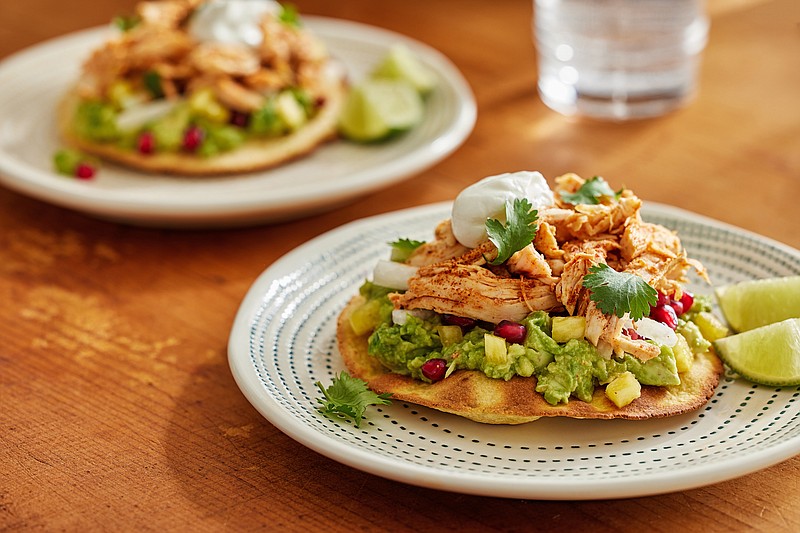 Baked chicken tostadas with guacamole are a fun, healthful dinner. (Photo for The Washington Post by Tom McCorkle)
