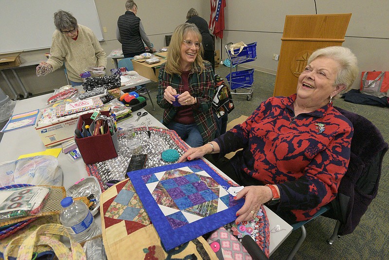 QUILT SHOW PREP
MaryBeth (cq) Fairchild and Joe (cq) Ann Reaves chat while pricing donated fabric on Friday March 3 2023 at the Rogers Public Library during preparation for the Quilters United In Learning Together quilt show set for April 21-22 at the Benton County Fairgrounds. Members put price tags on donated items, including fabric and sewing items, that will be sold at the show. Some 350 quilts will be on display, said Helen Hefner, co-chair of the show. Twenty-five vendors will also sell their wares. Attendees may also purchase chances at the show to win a quilt. Go to nwaonline.com/photos for today's photo gallery.
(NWA Democrat-Gazette/Flip Putthoff)