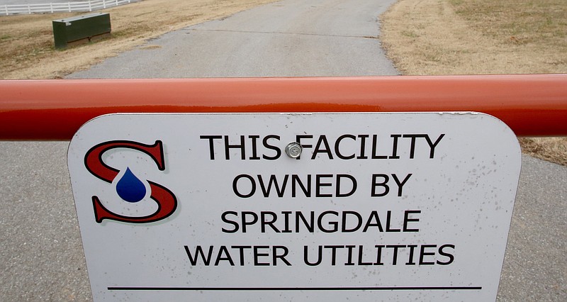 A sign at a Springdale Water Utilities lift station is seen Dec. 20, 2018, off Wagon Wheel Road in Springdale. (File Photo/NWA Democrat-Gazette)
