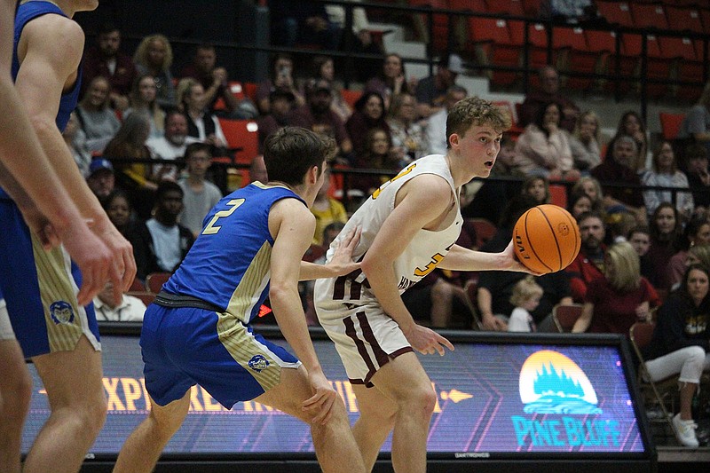 Lake Hamilton's Ty Robinson looks for a pass while Harrison's Kason Hilligoss (2) defends Saturday in the Class 5A state tournament semifinals at Pine Bluff Convention Center. - Photo by Krishnan Collins of The Sentinel-Record