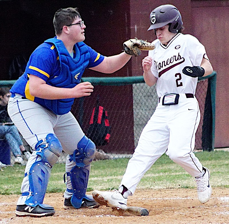 Randy Moll/Westside Eagle Observer
Riggs Harper crosses home plate for Gentry while the Cedarville catcher waits for the throw during play in the Merrill Reynolds Memorial Complex in Gentry on March 1.
