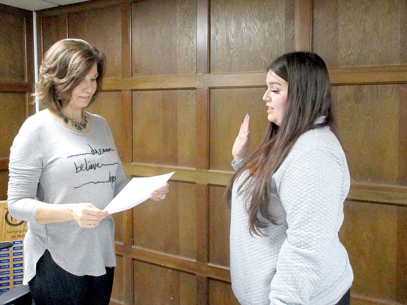 Marc Hayot/Herald-Leader West Siloam Springs Mayor Rhonda Wise (left), swears in new Ward 5 Trustee Mackenzie Denny during the town meeting on March 20. Denny will take over for former Trustee Sam Byers who stepped down for personal reasons.