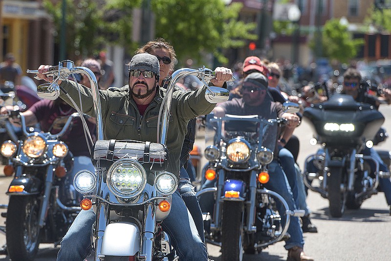 Bikers travel along Garrison Avenue on May 7, 2022, during day two of the 2022 Steel Horse Rally in downtown Fort Smith. Thousands of motorcycle enthusiasts rode into town for the annual charitable event.
(File Photo/River Valley Democrat-Gazette/Hank Layton)