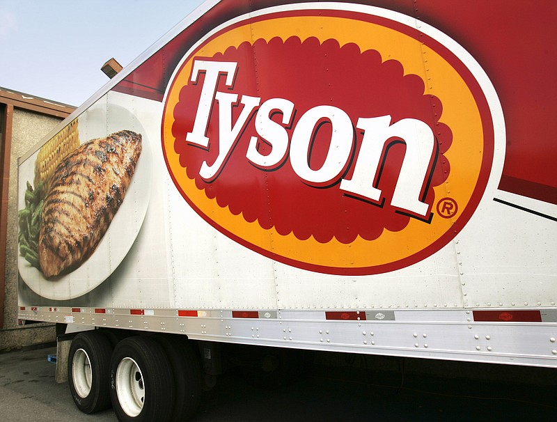 FILE - A Tyson Foods, Inc., truck is parked at a food warehouse on Oct. 28, 2009, in Little Rock, Ark. Thirty-four Tyson Foods employees, former employees and family members filed a lawsuit against the Arkansas-based company Monday, March 6, 2023, saying it failed to take appropriate precautions during the early days of the COVID pandemic. (AP Photo/Danny Johnston, File)