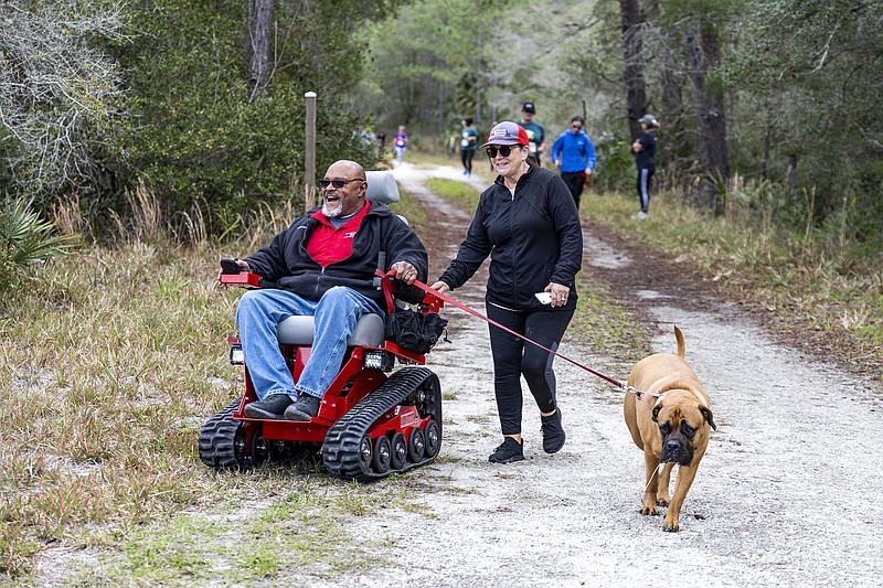 Cordell Jeter, president and owner of EcoRover Chairs, participates in Friends of Seminole State Forest's Run for the Woods on Sunday, Feb. 12, 2023. (Patrick Connolly/Orlando Sentinel/TNS)