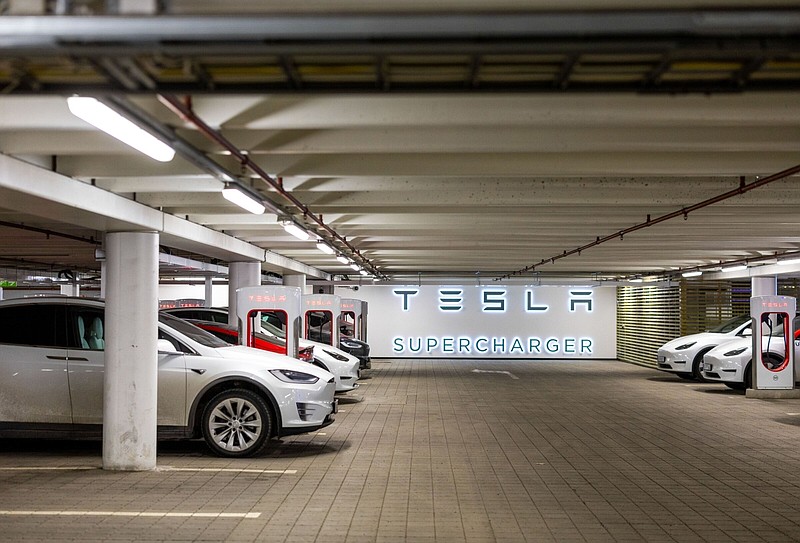 Electric automobiles charge at Tesla Inc. supercharger points at Ullevaal stadium in Oslo, Norway, on Monday, March 6, 2023. Norway's economy will grow at a slower pace than previously estimated, according to forecasts published by the finance ministry on Sunday. MUST CREDIT: Bloomberg photo by Fredrik Solstad