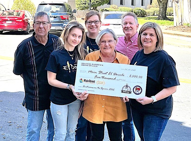 Members of the Arkansas Razorback Airstream Club present a check in the amount of $5,000 to Main Street El Dorado. Since 2018, MSE has teamed up with Airstreams on the Square Committee (ARAC) to present Airstreams on the Square and each year, ARAC makes a cash donation to MSE following the event. ARAC recently presented the donation from Airstreams 2022. On the front row, from left: Emilia Meinert, MSE staff; Jan Heavener, ARAC committee member; and Beth Brumley, MSE executive director. On the back row, from left, are Charles Heavener, ARAC committee member; Holly McDonald, MSE executive assistant; and Mark Magie, ARAC committee member. Airstreams 2023 is set for Oct. 19 - 22 and will feature a “Whodunnit” theme. (Contributed)