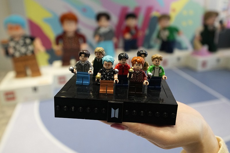 FILE - A LEGO set made of its blocks featuring K-pop band BTS, is shown during a publicity event at a store in Seoul, South Korea, on March 2, 2023. Danish toy company Lego said Tuesday March 7, 2023 that its net profit increased by 5% in 2022 coming in at 13.9 billion kroner ($2 billion), up from 13.3 billion kroner a year earlier. (AP Photo/Lee Jin-man, File)