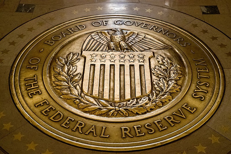 FILE- In this Feb. 5, 2018, file photo, the seal of the Board of Governors of the United States Federal Reserve System is displayed in the ground at the Marriner S. Eccles Federal Reserve Board Building in Washington.  As the Federal Reserve continues to increase interest rates, borrowers may find that they&#x2019;re paying more for their debts or perhaps missing out on opportunities to boost their savings with better rates.  (AP Photo/Andrew Harnik, File)