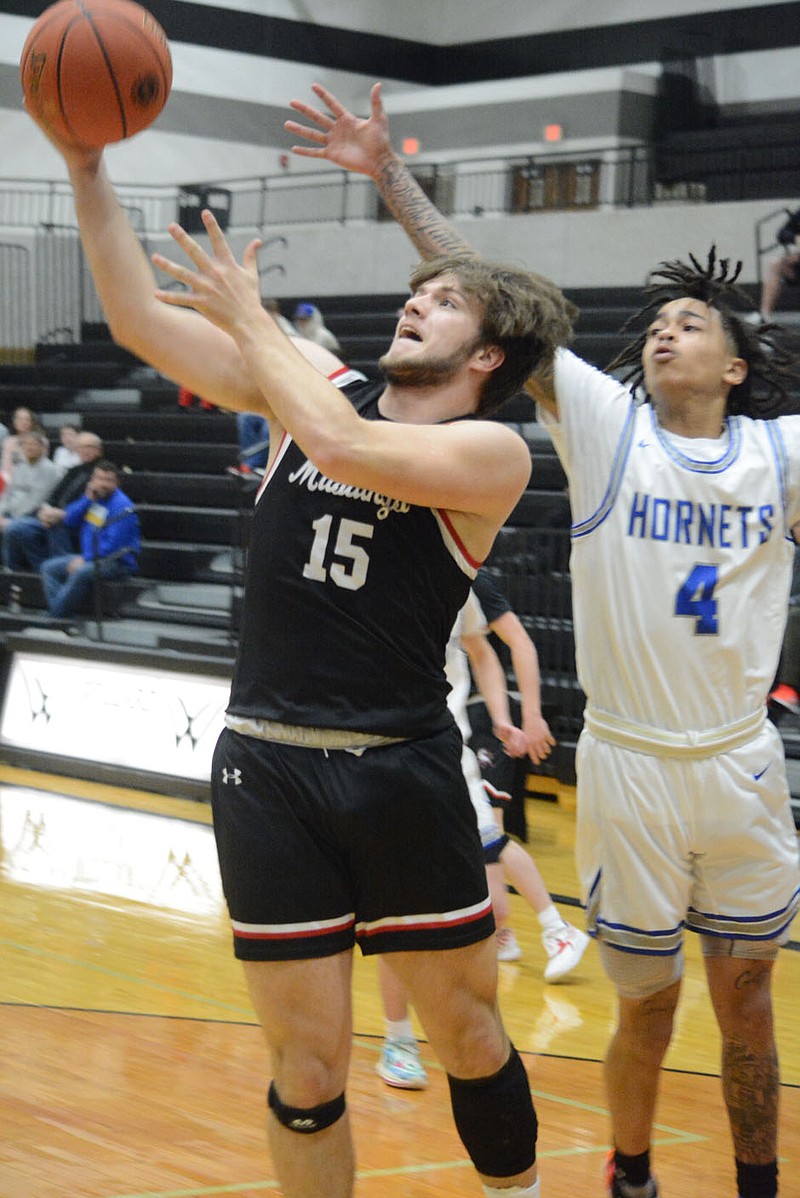 Bennett Horne/McDonald County Press Destyn Dowd (15) led a second-half surge in his team's district tournament game against the Hillcrest Hornets, finishing with nine points in the 60-43 loss at Willard on Wednesday, March 1.