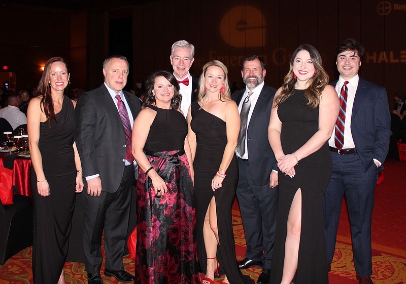 Danelle Cobb (from left), Dave Bealey, Misty Sauls, Ed Morgan, Misty Quaid, Kyden Reeh, Catie Beth Doyle and Gus Morgan help represent The Emerson Group in support of the American Heart Association at the Heart Ball on Feb. 24 at the Rogers Convention Center.
(NWA Democrat-Gazette/Carin Schoppmeyer)