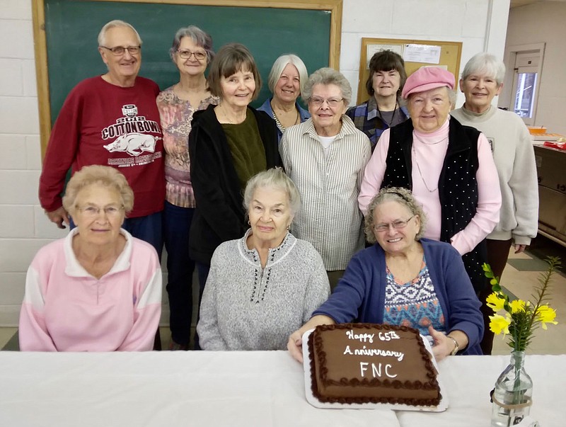 Submitted photo Members of the Friendly Neighbors of Sulphur Springs pose with a cake celebrating their 65 years of service to the community. A celebration was held at the regular monthly meeting of the group Thursday, March 2. Following a potluck luncheon, a business meeting was held and new members welcomed. Officers were elected for the coming year and it was decided to contribute a gift to a local family needing assistance. Friendly Neighbors meet the first Thursday of each month. Pictured are Anna Lee Emanuel (seated, left), Anna Brown and Rhonda Barnett, Ron and Rhonda Baerwald (back, left), Susan Hutcheson, Petite Parker, Maurine Styles, J.D. Wells, Violet Augustin and Lynn Howard.