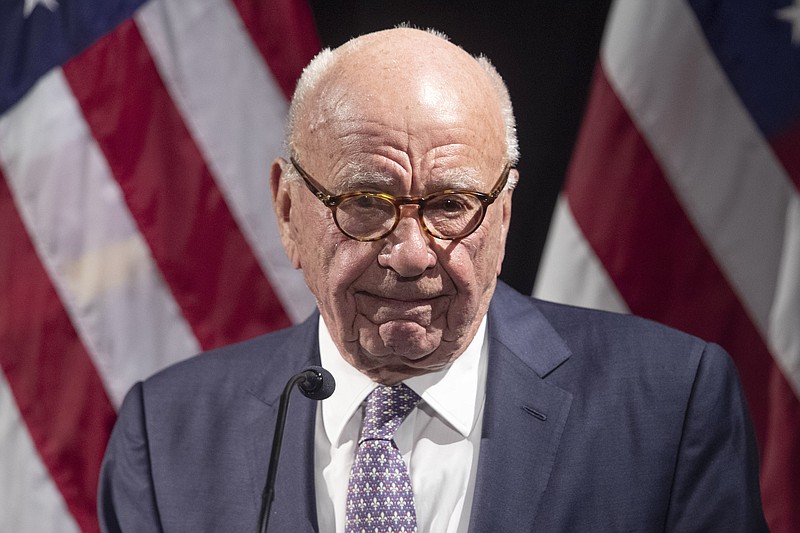 FILE - Rupert Murdoch introduces Secretary of State Mike Pompeo during the Herman Kahn Award Gala, Oct. 30, 2019, in New York. A defamation lawsuit against Fox News is revealing blunt behind-the-scenes opinions by its top figures about Donald Trump, including a Tucker Carlson text message where he said “I hate him passionately.” Carlson's private conversation was revealed in court papers at virtually the same time as the former president was hailing the Fox News host on social media for a “great job” for using U.S. Capitol security video to produce a false narrative of the Jan. 6, 2021, insurrection.  (AP Photo/Mary Altaffer, File)