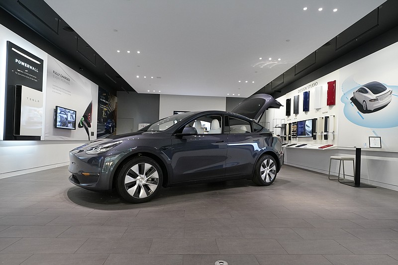 FILE - A Tesla Model Y Long Range is displayed on Feb. 24, 2021, at the Tesla Gallery in Troy, Mich. U.S. auto safety regulators have opened an investigation into Tesla&#x2019;s Model Y SUV after getting two complaints that the steering wheels can come off while being driven. The National Highway Traffic Safety Administration says the probe covers an estimated 120,000 vehicles from the 2023 model year.  (AP Photo/Carlos Osorio, File)