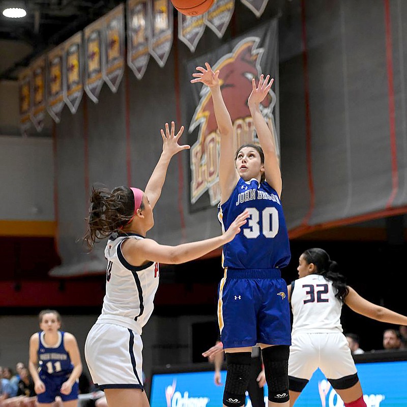 Photo courtesy of Parker Waters
John Brown guard Natalie Smith (No. 30) launches a 3-point shot in the Golden Eagles' NAIA National Tournament Second Round game against Cumberlands (Ky.) on Wednesday. Cumberlands defeated JBU 75-67 to end the Golden Eagles' season at 21-10 overall.