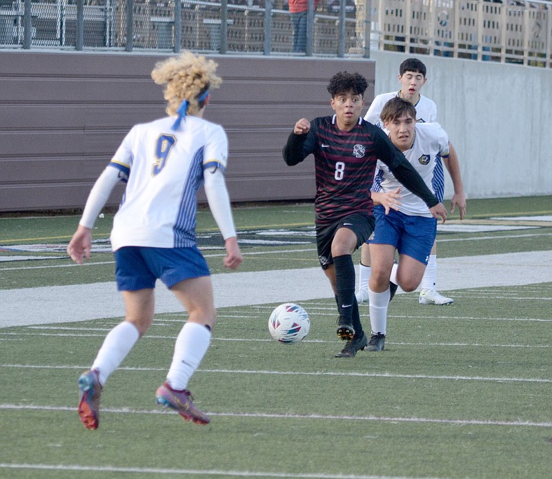 Graham Thomas/Herald-Leader
Siloam Springs freshman striker Anderson Lara possesses the ball as Mountain Home's Isaiah Kemp defends during Friday's game at Panther Stadium. The Bombers defeated the Panthers 2-1.