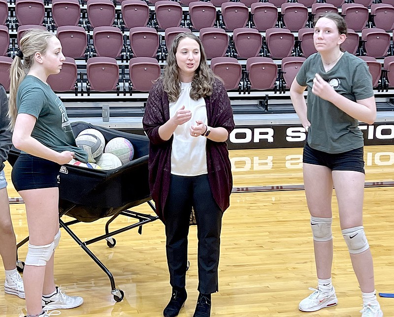 Graham Thomas/Herald-Leader
Siloam Springs rising sophomores Story Castagna (left) and Melanie Boyd (right) listen as new Lady Panthers volleyball coach Carrie Ciesla Thammarath gives instructions during volleyball practice on Friday. Thammarath, a former Greenwood and John Brown volleyball standout, was hired as volleyball coach on Thursday by the Siloam Springs School Board.