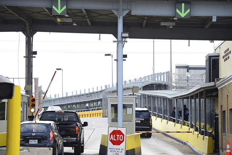 Motorists pay a bridge toll at Gateway International Bridge on Monday, March 6, 2023, in Brownsville, Texas, to cross into Matamoros, Mexico. Gunmen kidnapped four U.S. citizens who crossed into Mexico from Texas last week to buy medicine but were caught in a shootout that killed at least one Mexican citizen, U.S. and Mexican officials said Monday. (Miguel Roberts/The Brownsville Herald via AP)