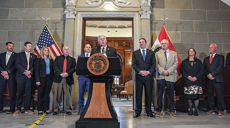 Julie Smith/News Tribune
Flanked Thursday by elected Missouri officials and  representatives of agricultural agencies and associations, Gov. Mike Parson speaks to the media about a lawsuit filed by Attorney General Andrew Bailey against the Biden Administration regarding proposed Waters of the United States rules.