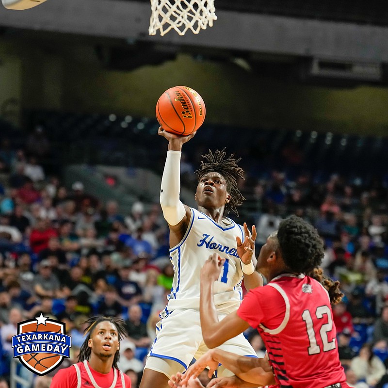 Hooks' Jatavious Johnson (11) shoots a short jumper in front of a Hitchcock defender during a Class 3A state semifinal basketball game. (Photo courtesy of Texarkana Gameday)