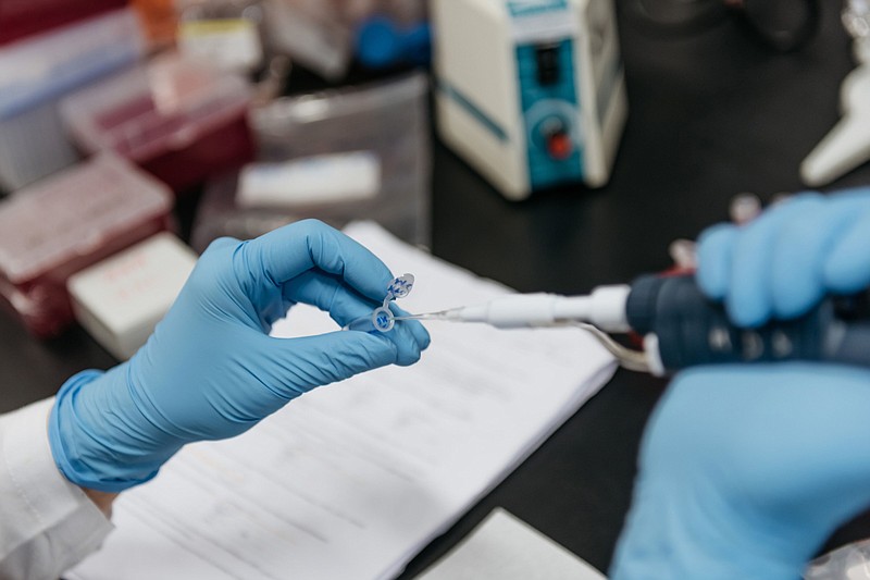 A laboratory technician pipettes test sample in Hong Kong, China, on Tuesday, June 20, 2017. MUST CREDIT: Bloomberg photo by Anthony Kwan