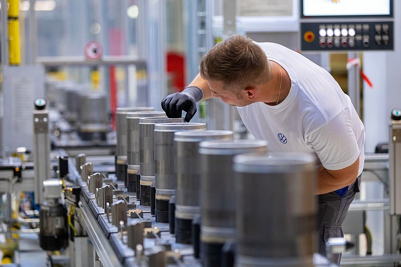 An employee checks the finished components on the electric motor rotor production line at the SalzGiga fuel cell gigafactory, operated by Volkswagen Group Components, in Salzgitter, Germany, on Wednesday, May 18, 2022. VW's future battery hub at Salzgitter will start production in 2025 for the company's volume cars. MUST CREDIT: Bloomberg photo by Krisztian Bocsi