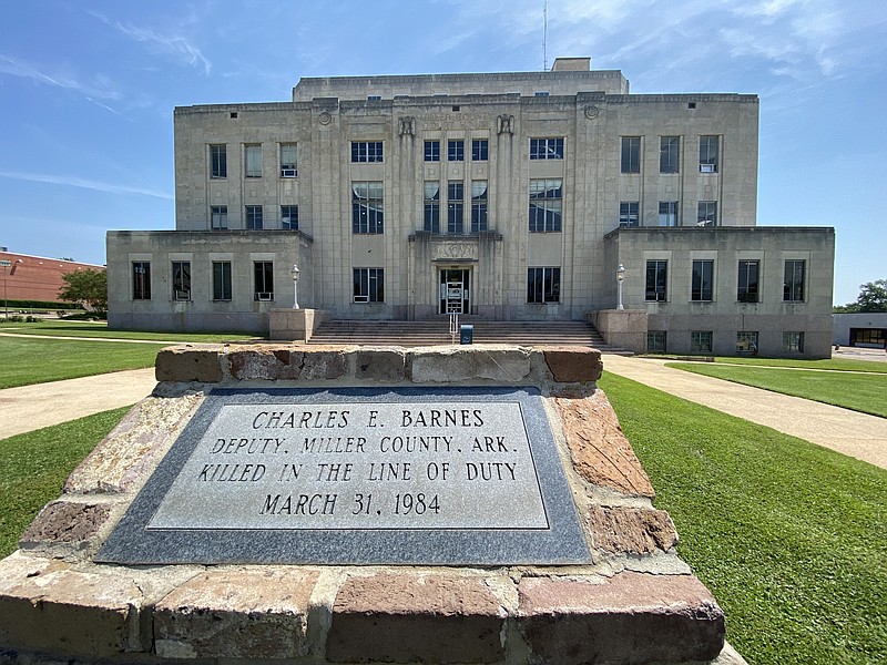 A plaque honoring slain Deputy Charles Barnes is seen Friday, May 13, 2022, outside the main entrance of the Miller County Courthouse on Laurel Street in Texarkana, Arkansas. (Gazette file photo)