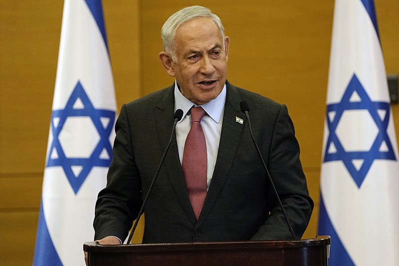 Israeli Prime Minister Benjamin Netanyahu at the Knesset, Israel's parliament, in Jerusalem, Monday, March 13, 2023. Netanyahu spoke as his coalition pressed ahead with a contentious plan to overhaul the country's judicial system. Speaking to members of his party, he lashed out at the Israeli media, saying they are broadcasting a "never ending tsunami of fake news" against him. He reiterated his claim that the legal overhaul will strengthen Israeli democracy. (AP Photo/Ohad Zwigenberg)