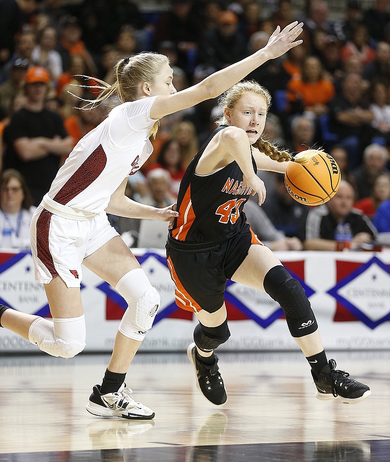 Nashville's Shalyn Lyle (43) drives to the basket while guarded by Farmington's Marin Adams (2) during the second quarter of the Farmington's 65-61 win in the Class 4A girls state championship game on Thursday at Bank OZK Arena in Hot Springs. (Arkansas Democrat-Gazette/Thomas Metthe)