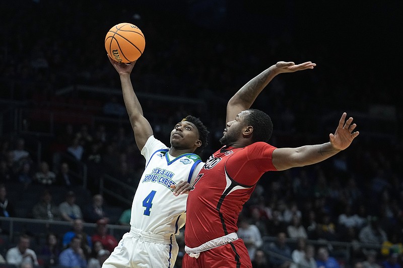 Texas A&amp;M Corpus Christi's Jalen Jackson (4) shoots against Southeast Missouri State's Phillip Russell (1) during the first half of a First Four college basketball game in the NCAA men's basketball tournament, Tuesday, March 14, 2023, in Dayton, Ohio. (AP Photo/Darron Cummings)